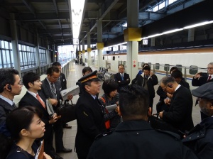 Kanazawa station master giving a briefing